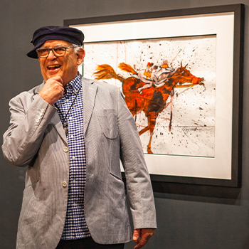 Ralph Steadman in front of his art