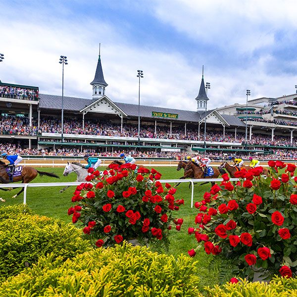 Churchill Downs Grandstand with horses running by