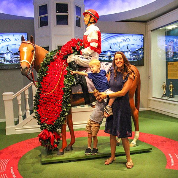 Perdue kids and mother in Winners Circle exhibit