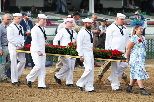 Garland of Roses being escorted out to the Winner's Circle